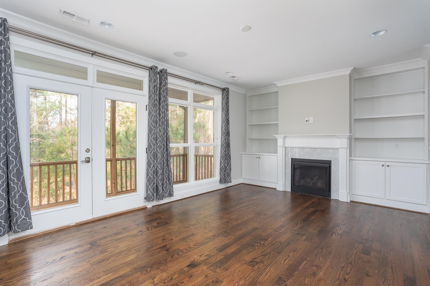 830 The Village Circle Raleigh, NC 27615 - Photo 14 of 34 Family Room - View of Natural Area Backyard