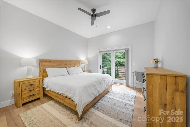 a bedroom with a bed dresser and a window