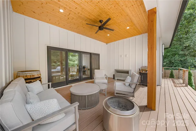 a view of balcony with chairs and wooden floor