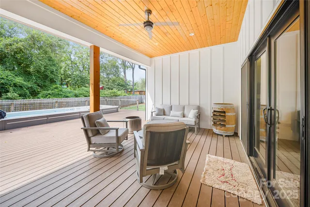 a view of a house with a yard and sitting area