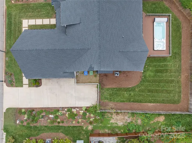 a view of a backyard of the house