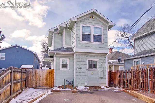 a front view of a house with a garage