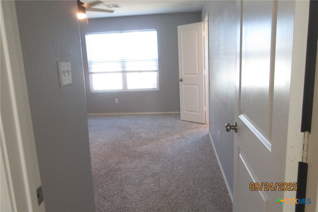 125 Greatest Gift Way Jarrell, TX 76537 - Photo 12 of 24 a view of an empty room with a window