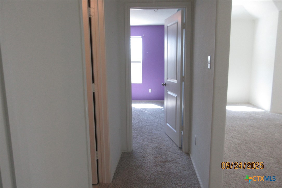 125 Greatest Gift Way Jarrell, TX 76537 - Photo 21 of 24 a view of a hallway to rooms