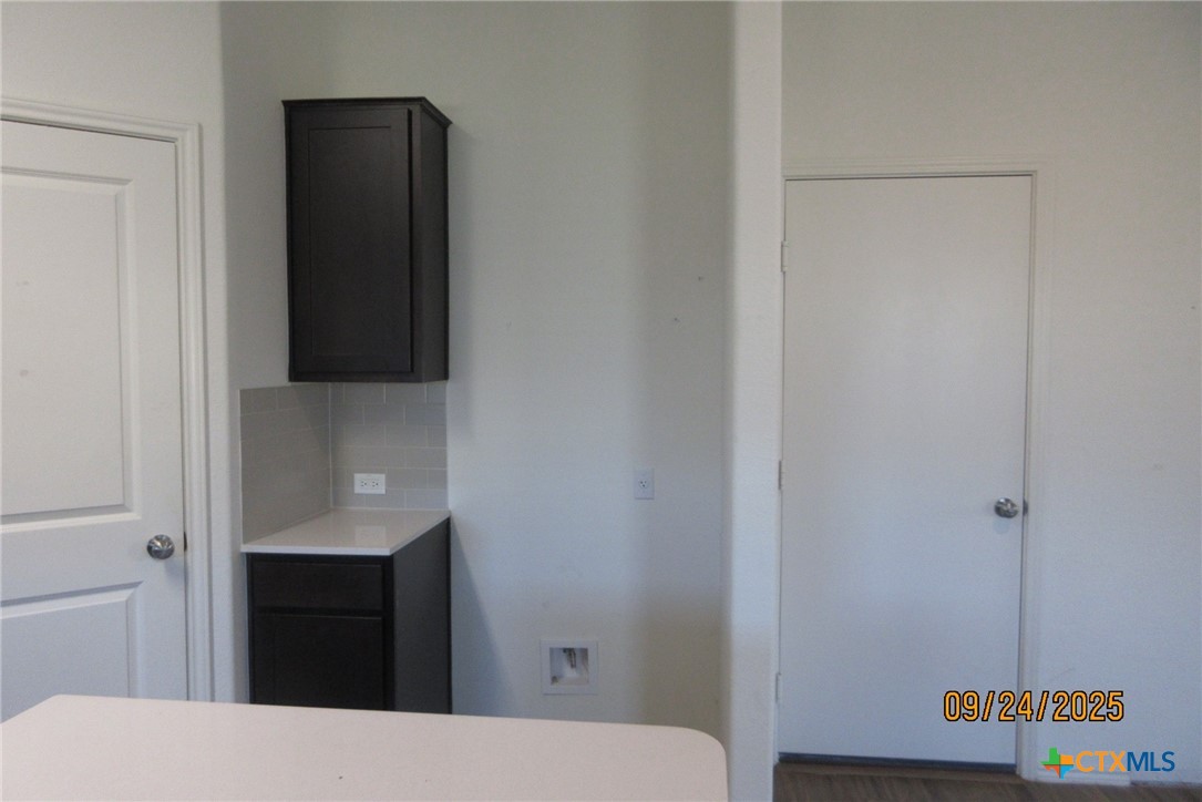 125 Greatest Gift Way Jarrell, TX 76537 - Photo 6 of 24 a bathroom with a sink and a mirror