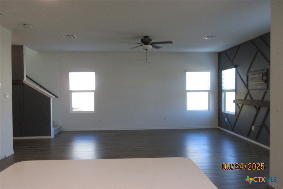 125 Greatest Gift Way Jarrell, TX 76537 - Photo 7 of 24 wooden floor in an empty room with a window
