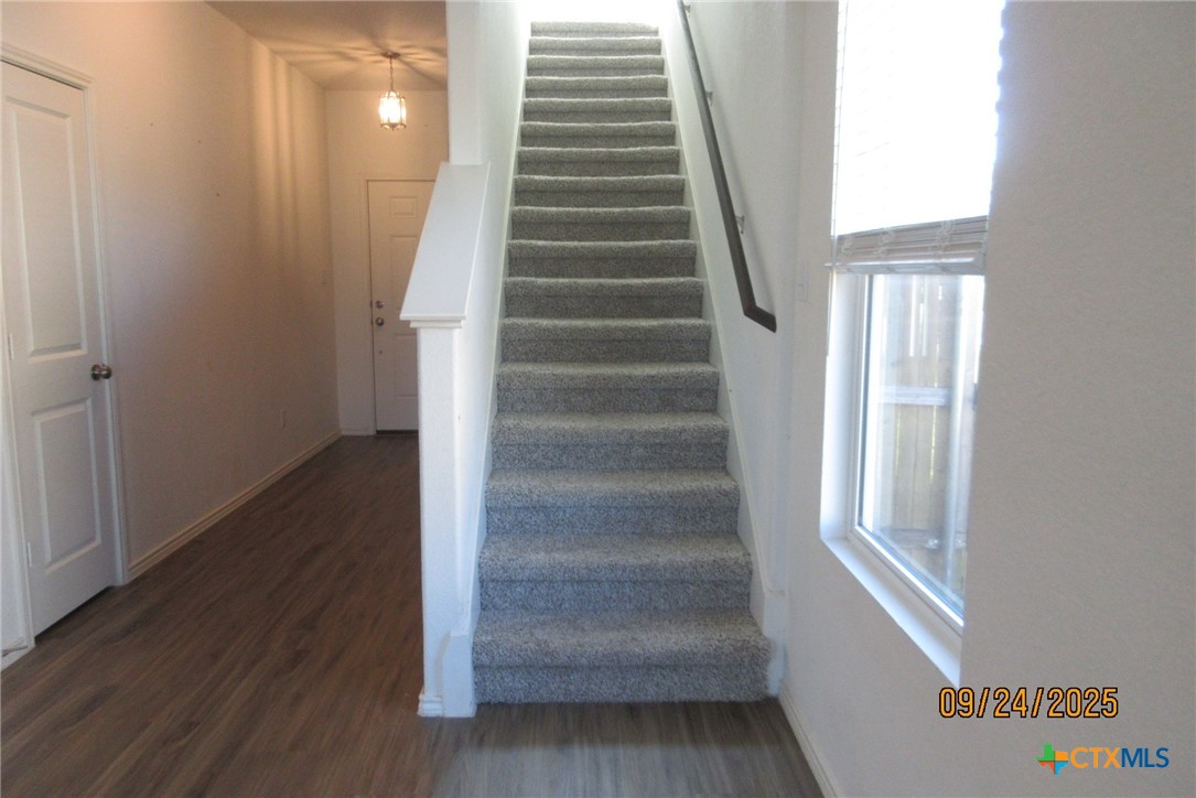 125 Greatest Gift Way Jarrell, TX 76537 - Photo 8 of 24 a view of entryway and hall with wooden floor