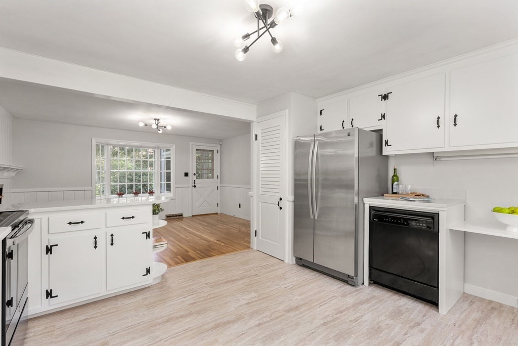 406 Chestnut Street Ashland, MA 01721 - Photo 15 of 28 a kitchen with stainless steel appliances a refrigerator sink and cabinets