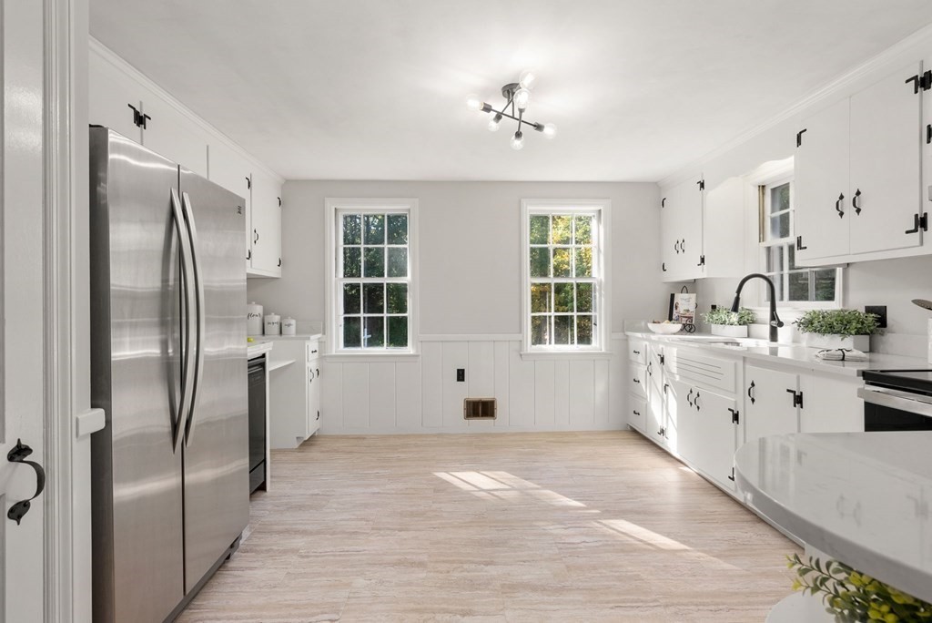 406 Chestnut Street Ashland, MA 01721 - Photo 17 of 28 a large white kitchen with cabinets and stainless steel appliances
