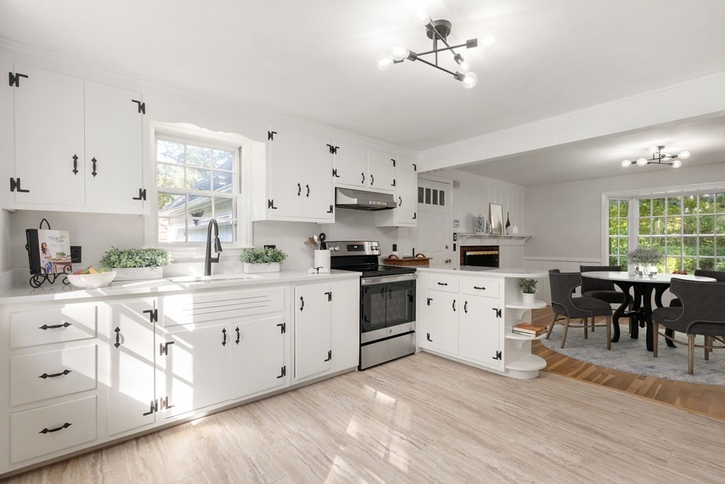 406 Chestnut Street Ashland, MA 01721 - Photo 2 of 28 a kitchen with white cabinets and white appliances