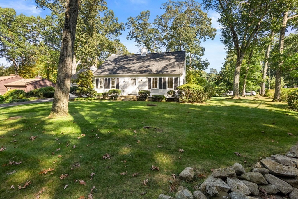 406 Chestnut Street Ashland, MA 01721 - Photo 24 of 28 a view of a house with a big yard and large trees