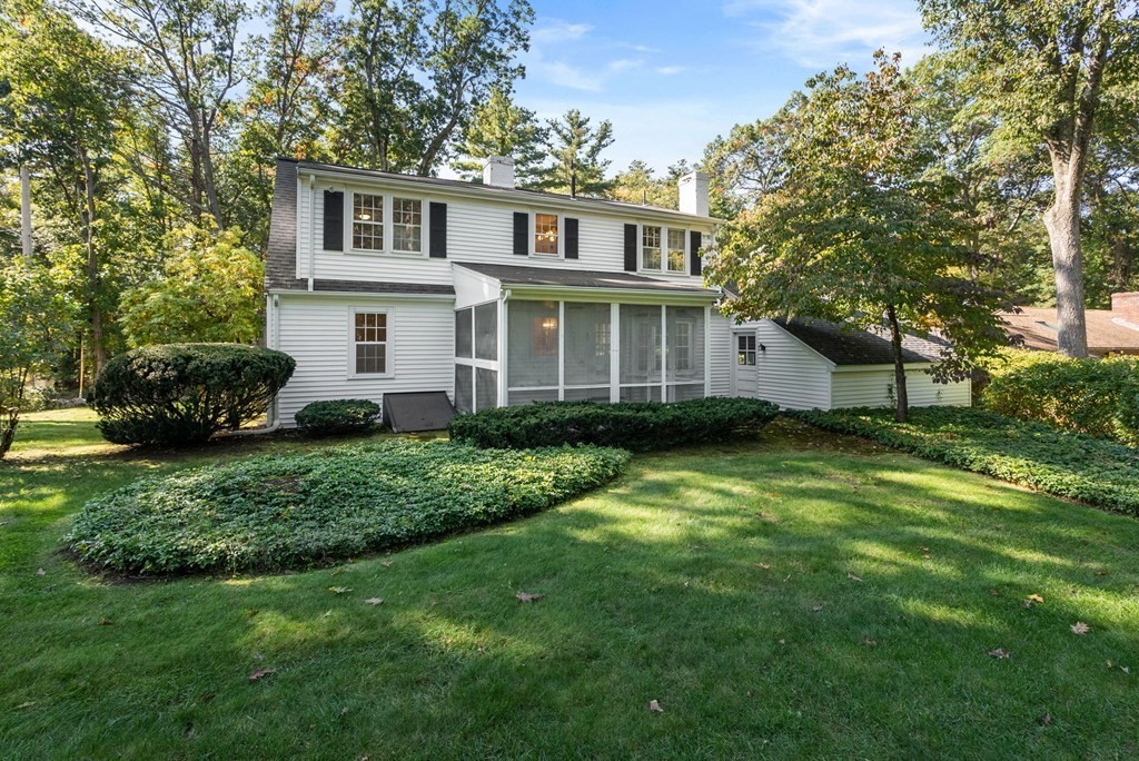 406 Chestnut Street Ashland, MA 01721 - Photo 27 of 28 a front view of a house with a garden