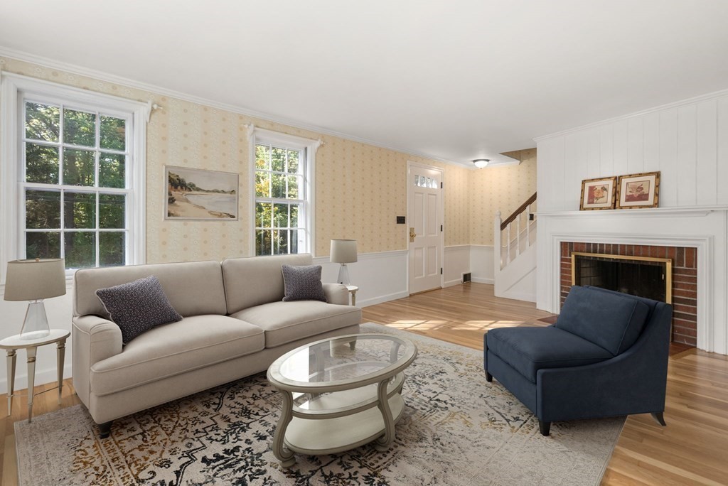 406 Chestnut Street Ashland, MA 01721 - Photo 6 of 28 a living room with furniture and a fireplace