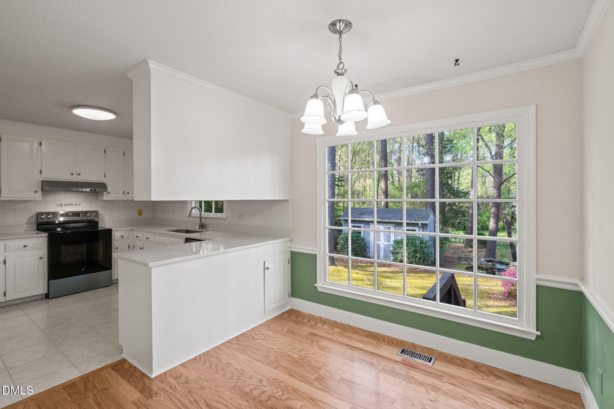 6115 Winthrop Drive Raleigh, NC 27612 - Photo 11 of 41 a kitchen that has a lot of cabinets