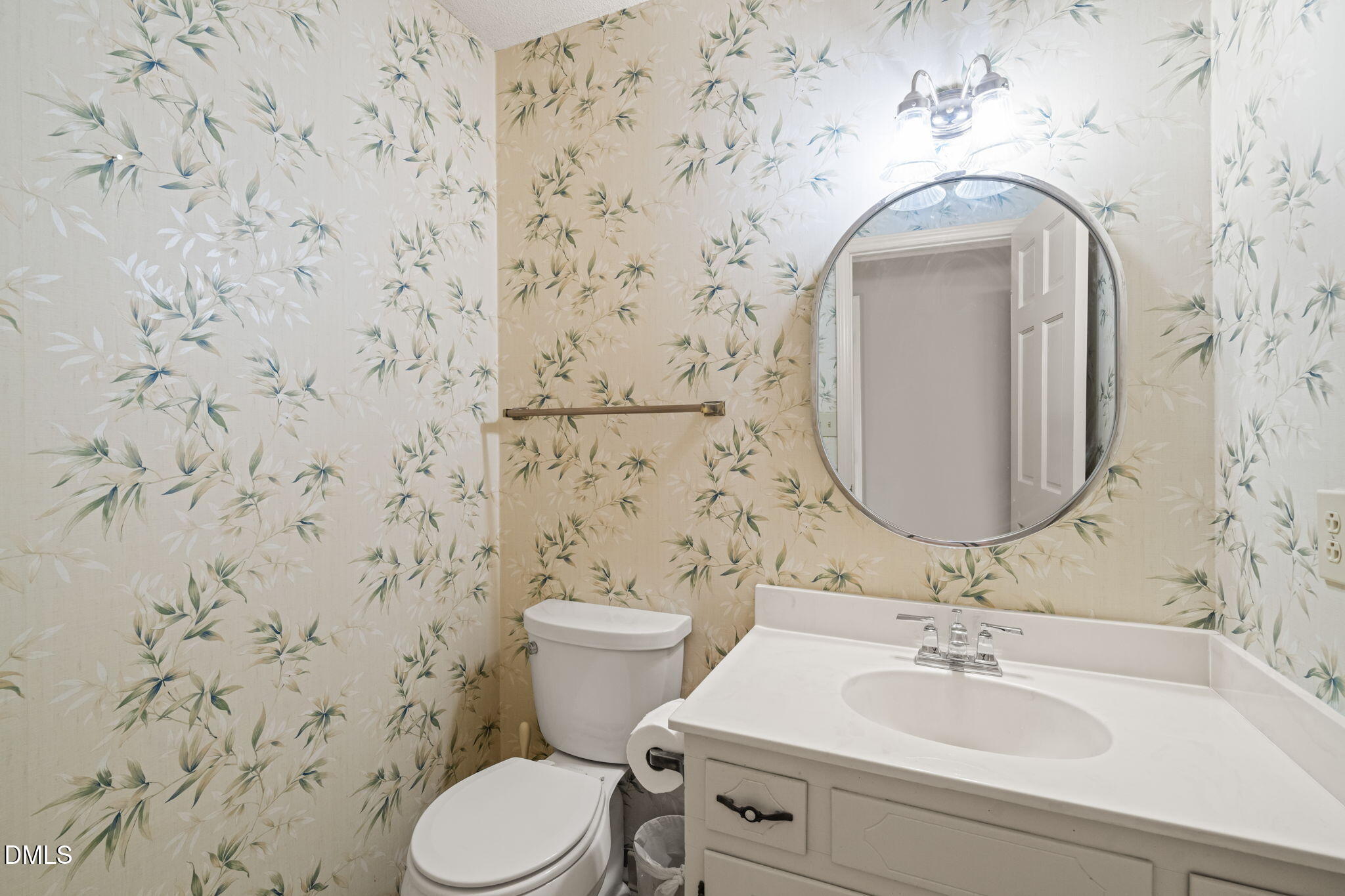 6115 Winthrop Drive Raleigh, NC 27612 - Photo 18 of 41 a bathroom with a sink and a mirror