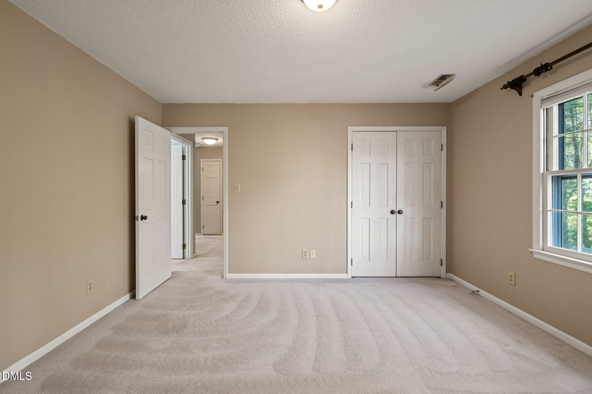 6115 Winthrop Drive Raleigh, NC 27612 - Photo 20 of 41 a view of an empty room with a window