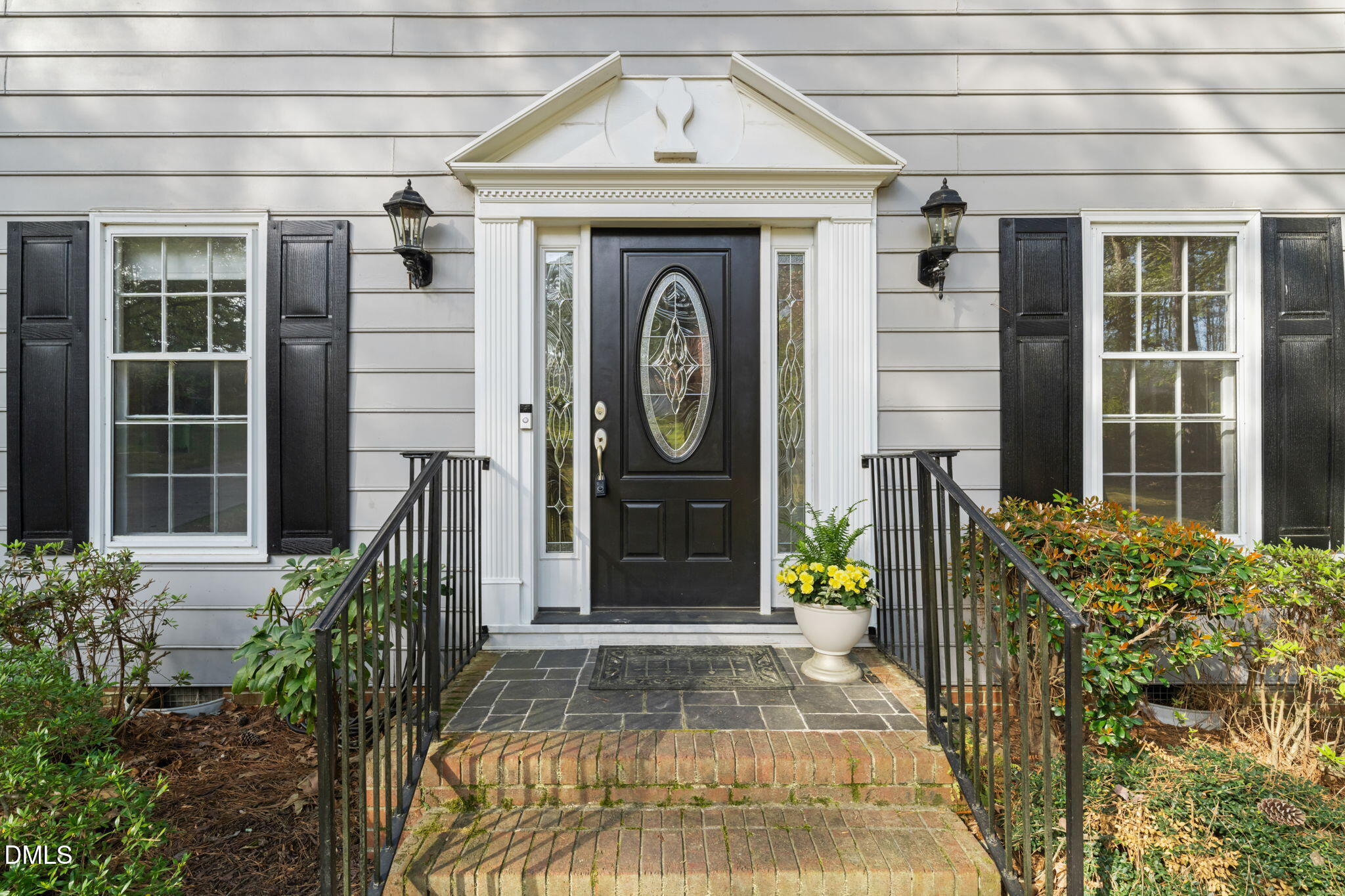 6115 Winthrop Drive Raleigh, NC 27612 - Photo 2 of 41 a front view of a house with garden