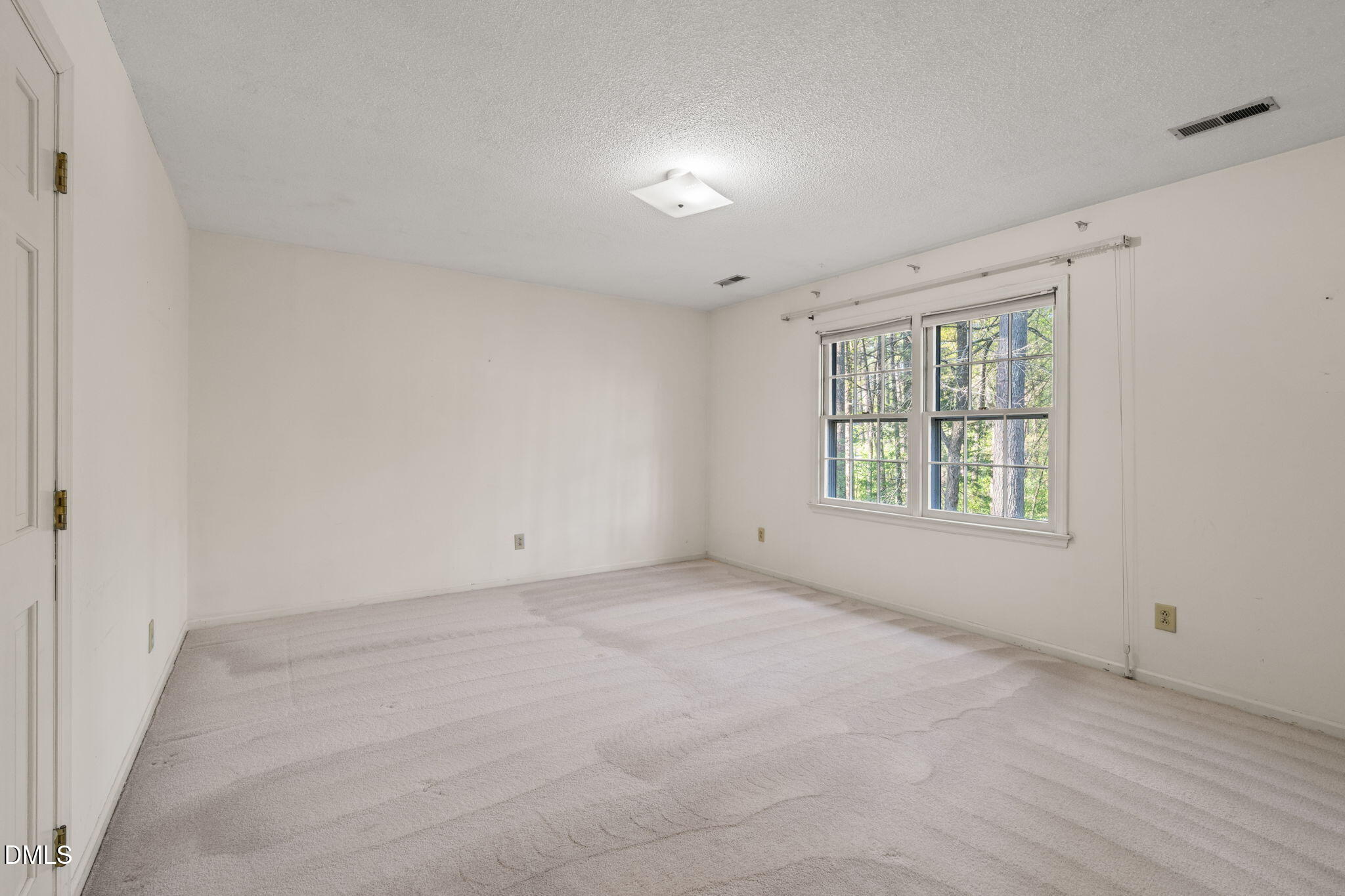 6115 Winthrop Drive Raleigh, NC 27612 - Photo 24 of 41 an empty room with windows
