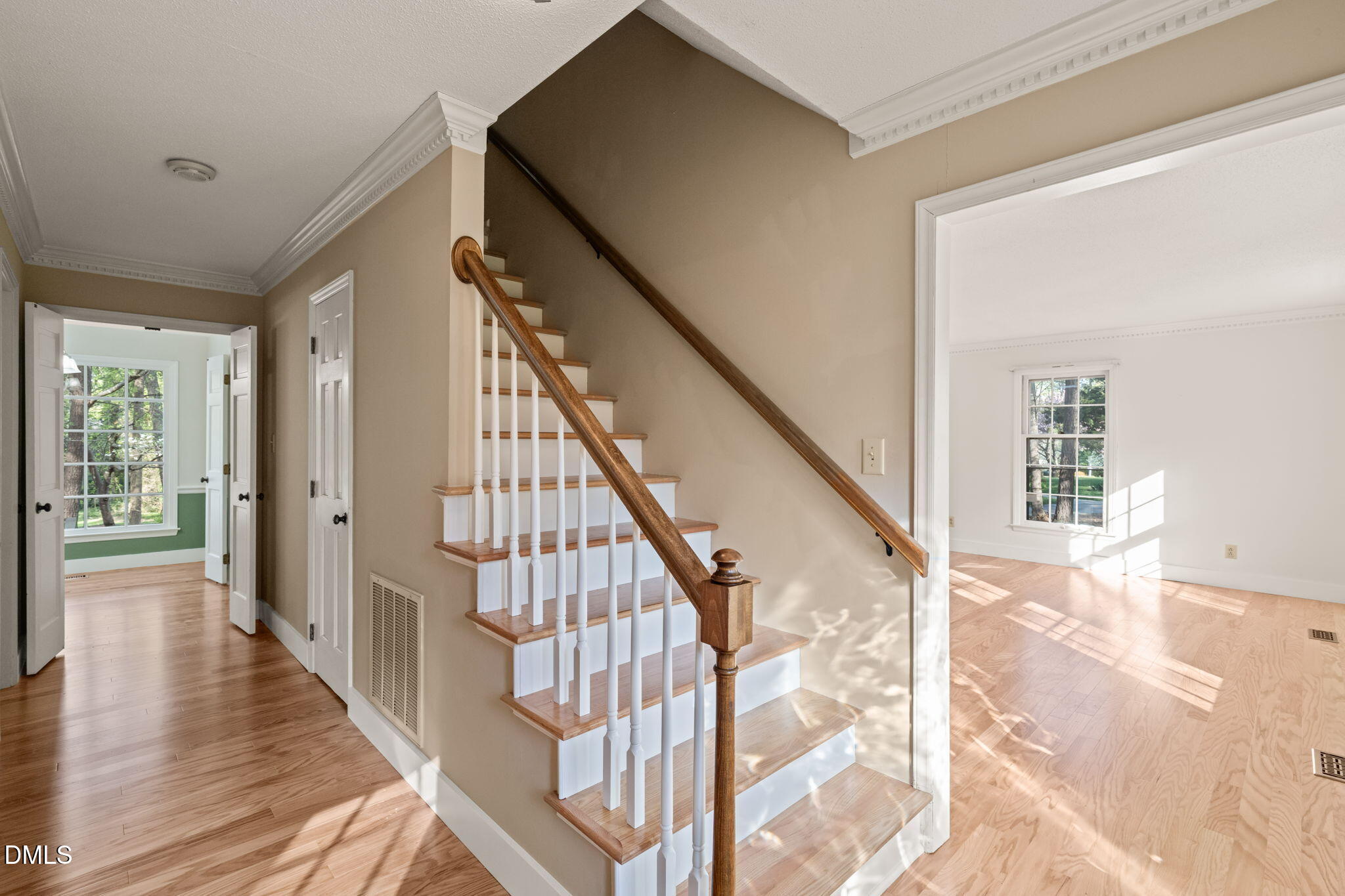 6115 Winthrop Drive Raleigh, NC 27612 - Photo 4 of 41 a view of an entryway with wooden floor and stairs