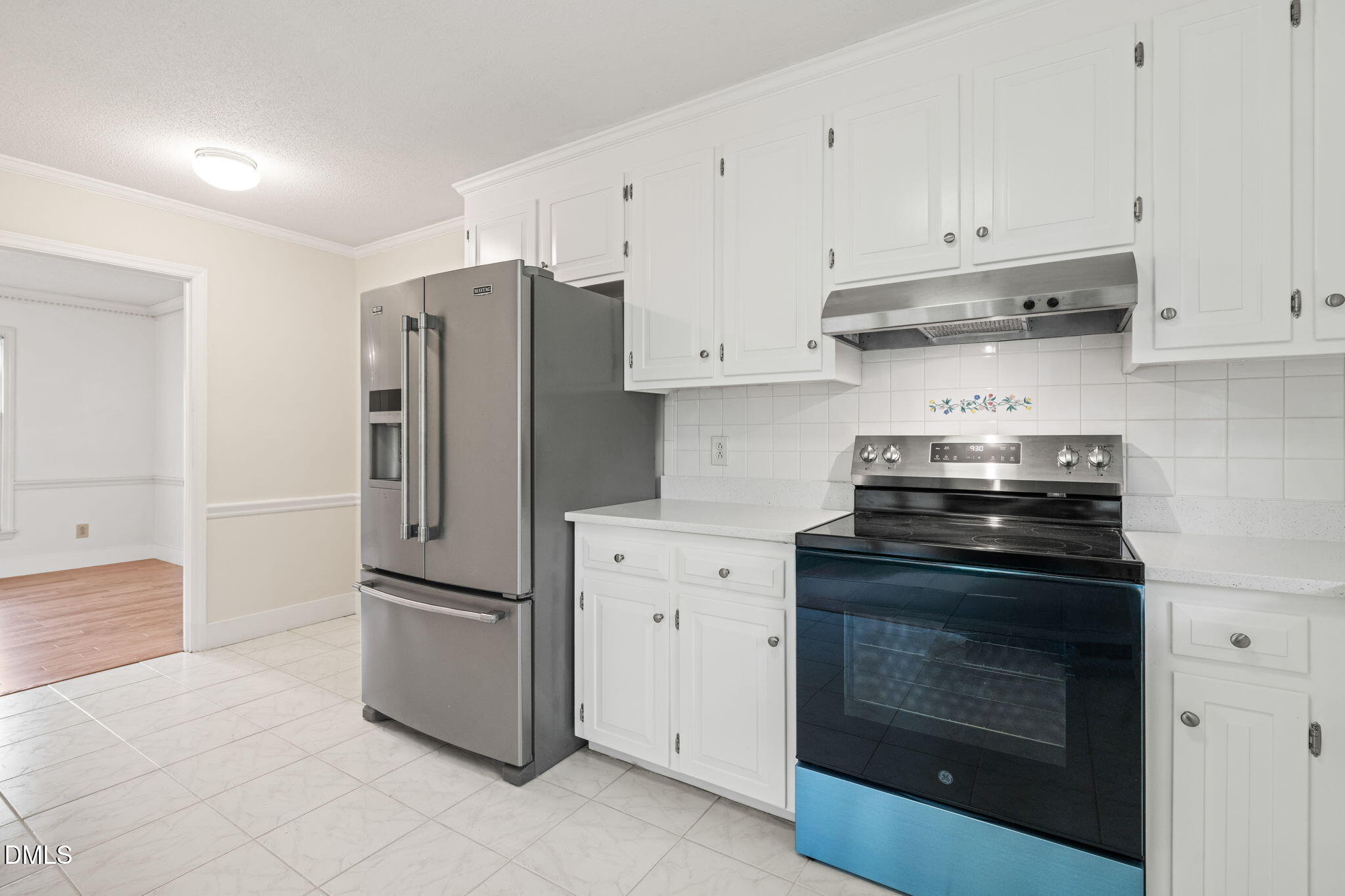 6115 Winthrop Drive Raleigh, NC 27612 - Photo 8 of 41 a kitchen with cabinets and stainless steel appliances