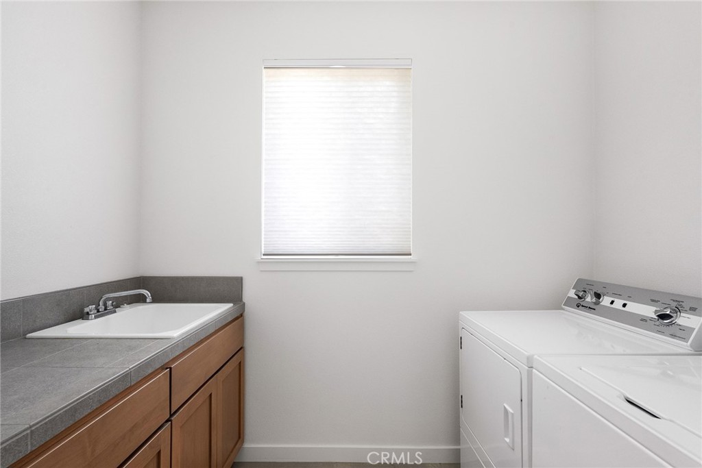 377 Bellamy Terrace Chico, CA 95973 - Photo 29 of 44 Laundry room with sink and counter.