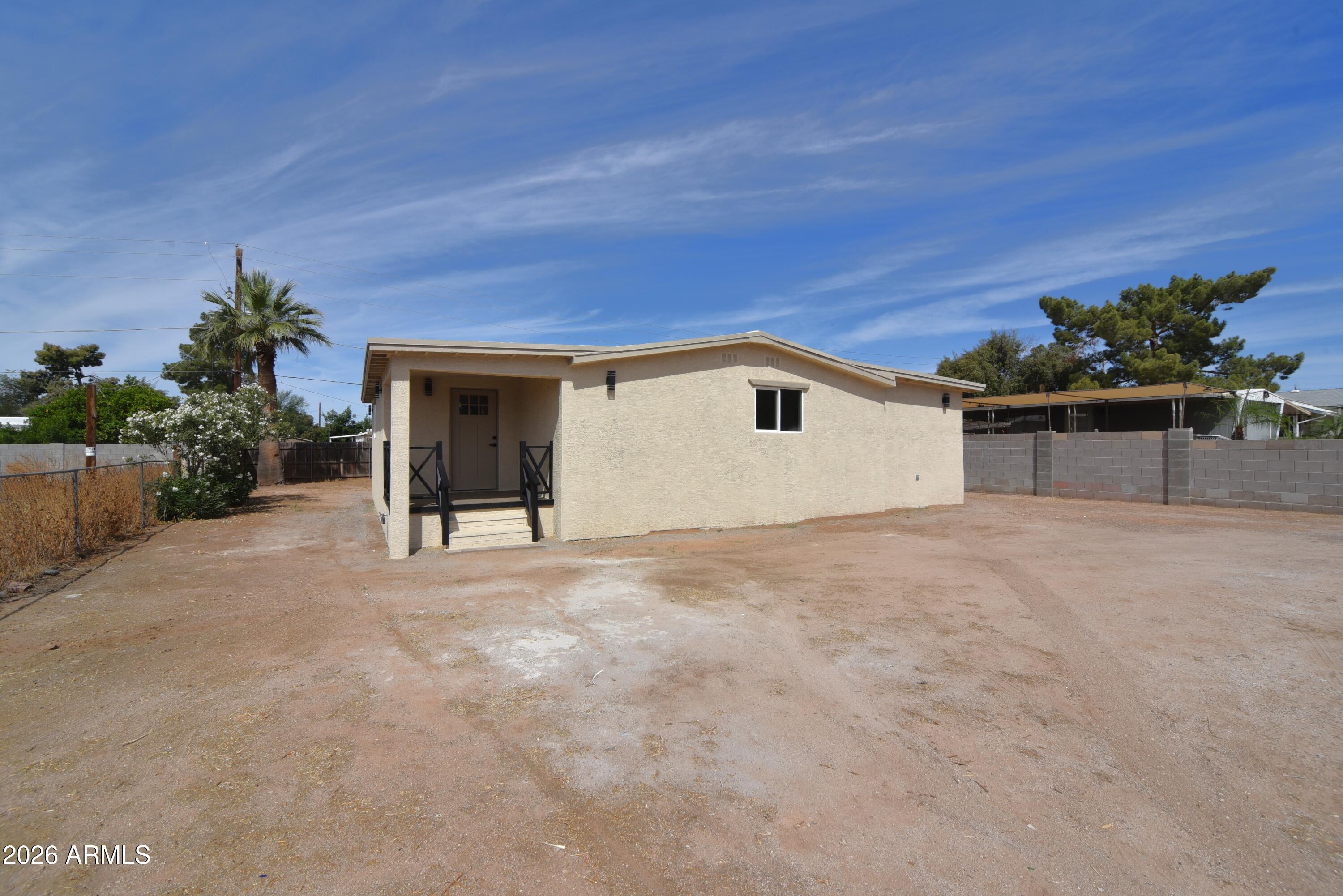 a view of a house with a yard and garage