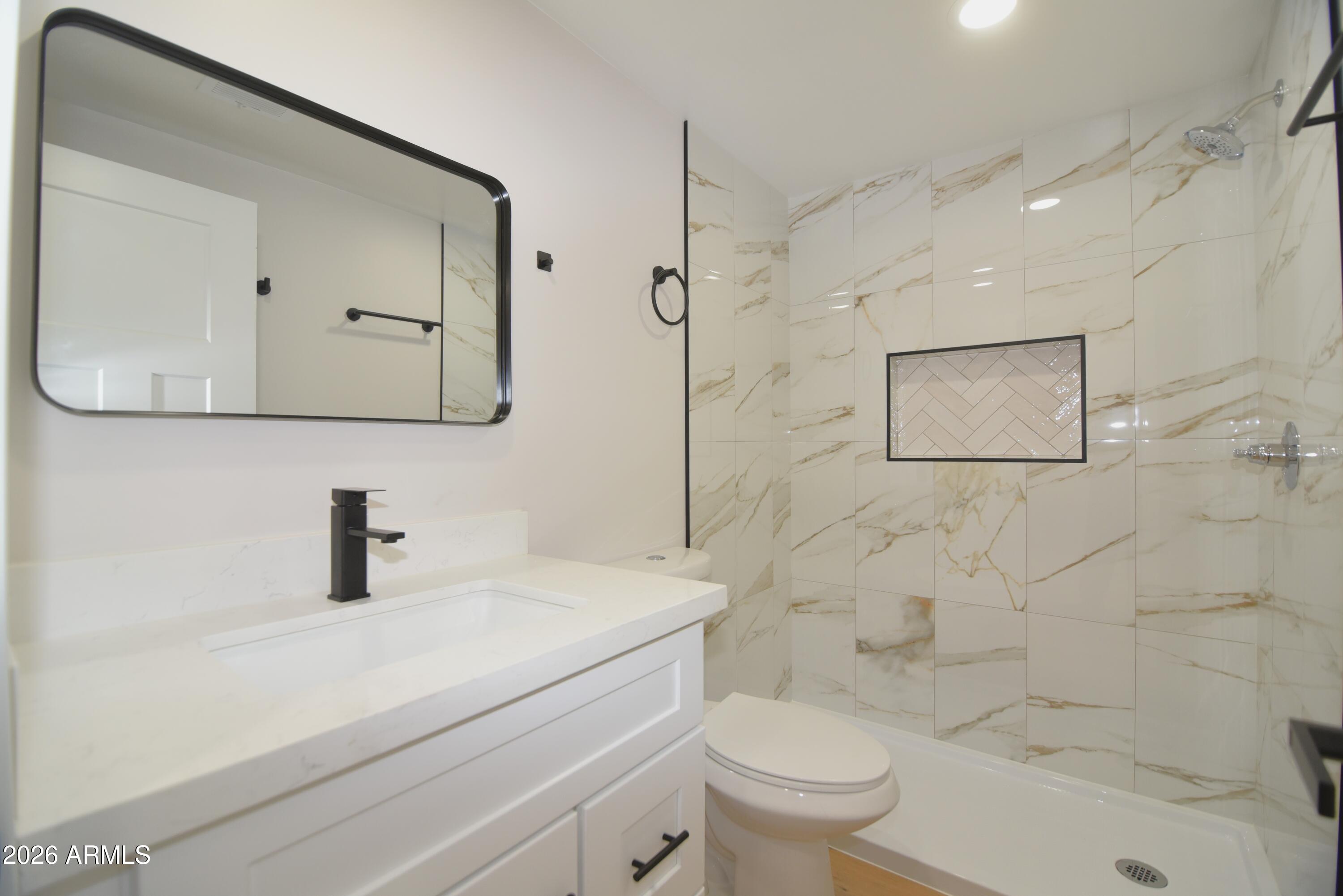 508 South 98th Street Mesa, AZ 85208 - Photo 13 of 34 a bathroom with a sink a toilet and shower