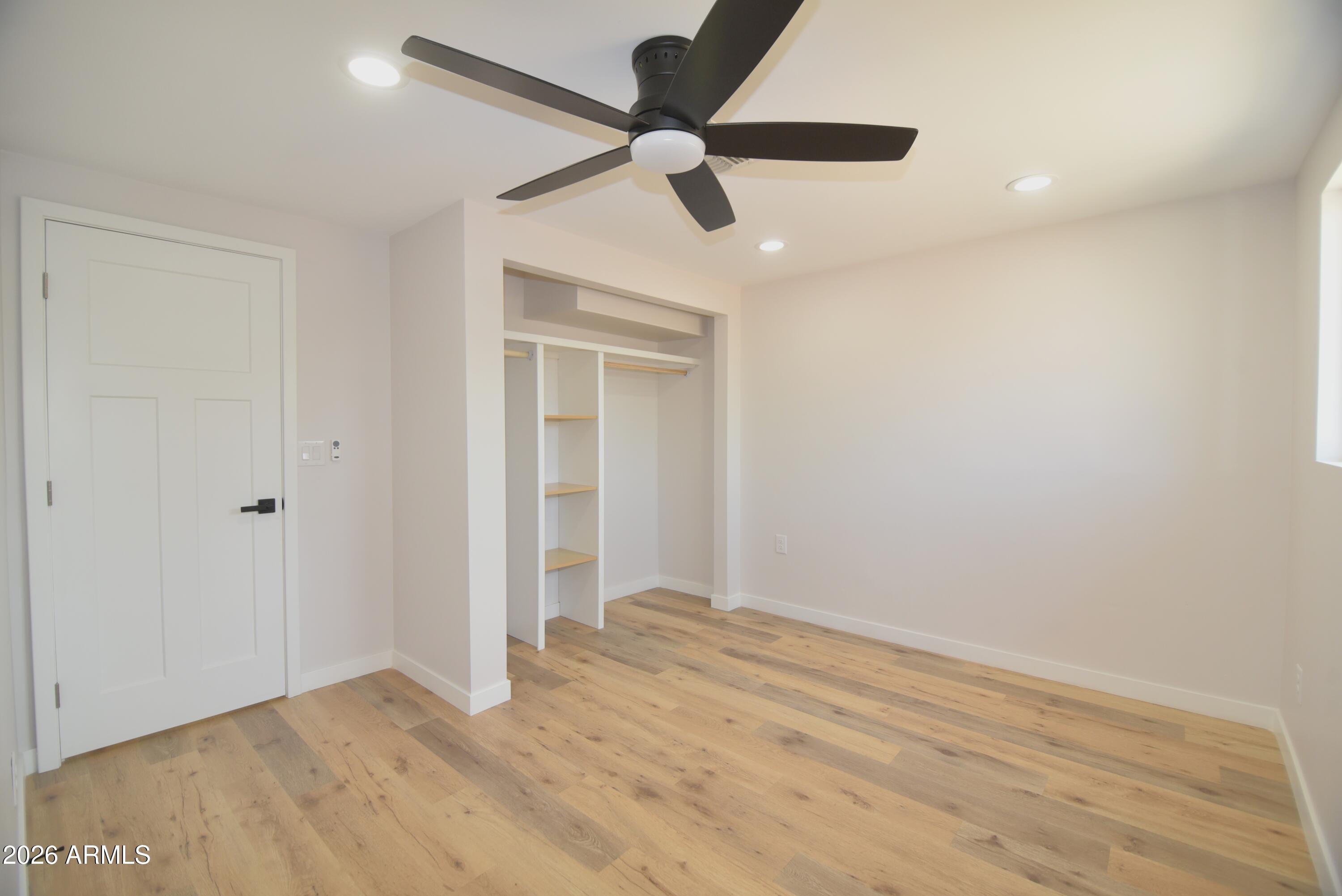 508 South 98th Street Mesa, AZ 85208 - Photo 18 of 34 a view of empty room with wooden floor