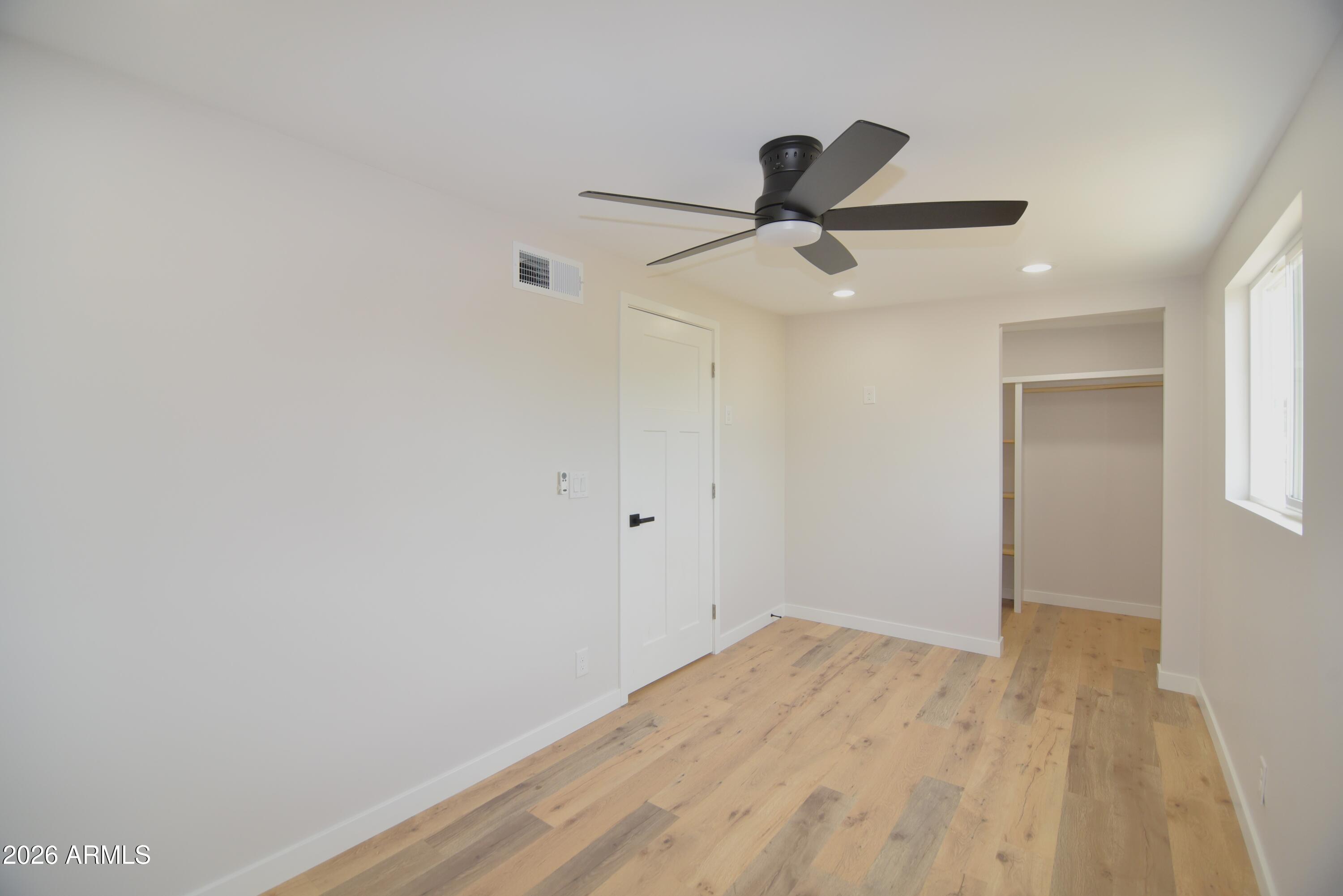 508 South 98th Street Mesa, AZ 85208 - Photo 23 of 34 a view of empty room with wooden floor