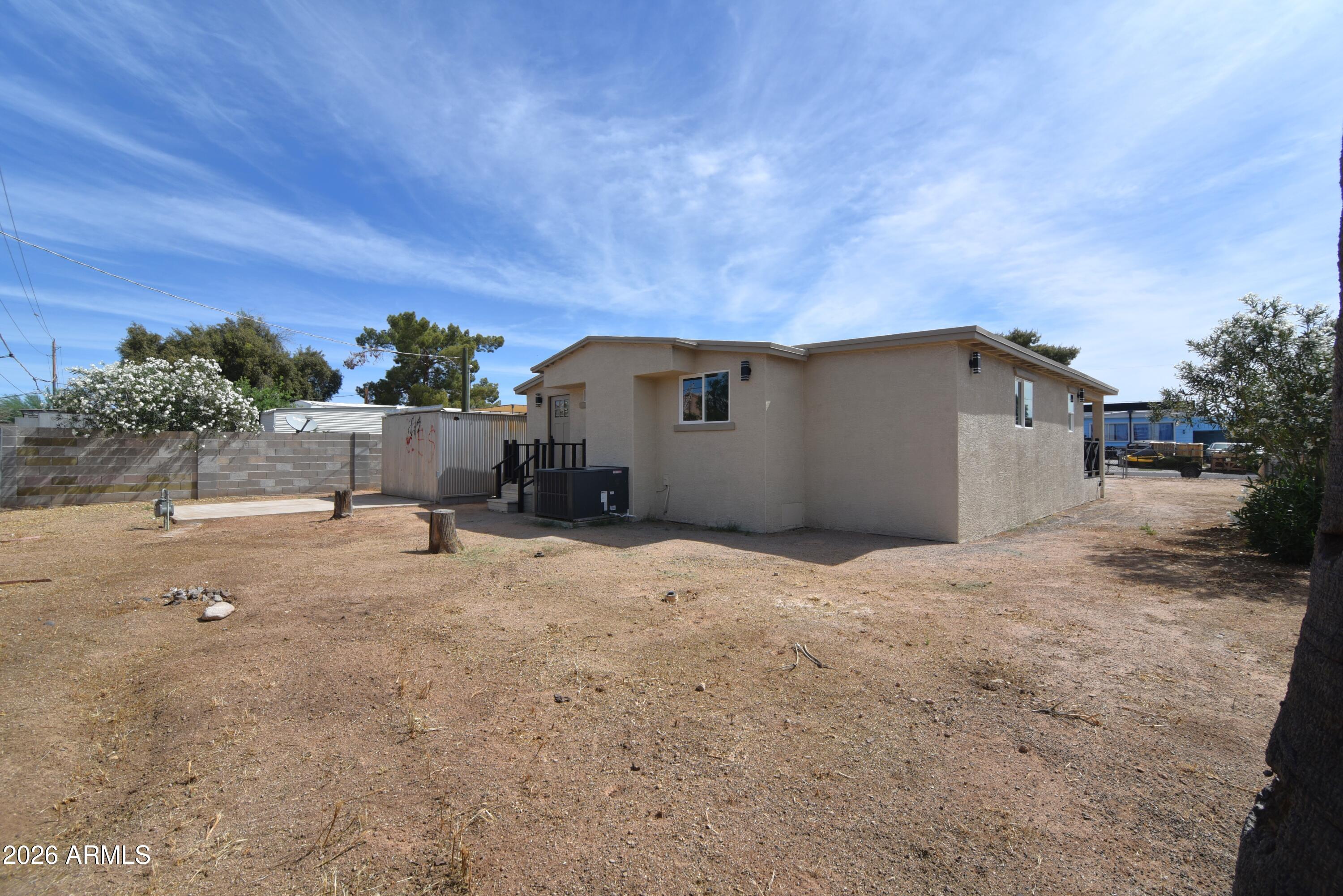 508 South 98th Street Mesa, AZ 85208 - Photo 25 of 34 a backyard of a house with a yard and seating space