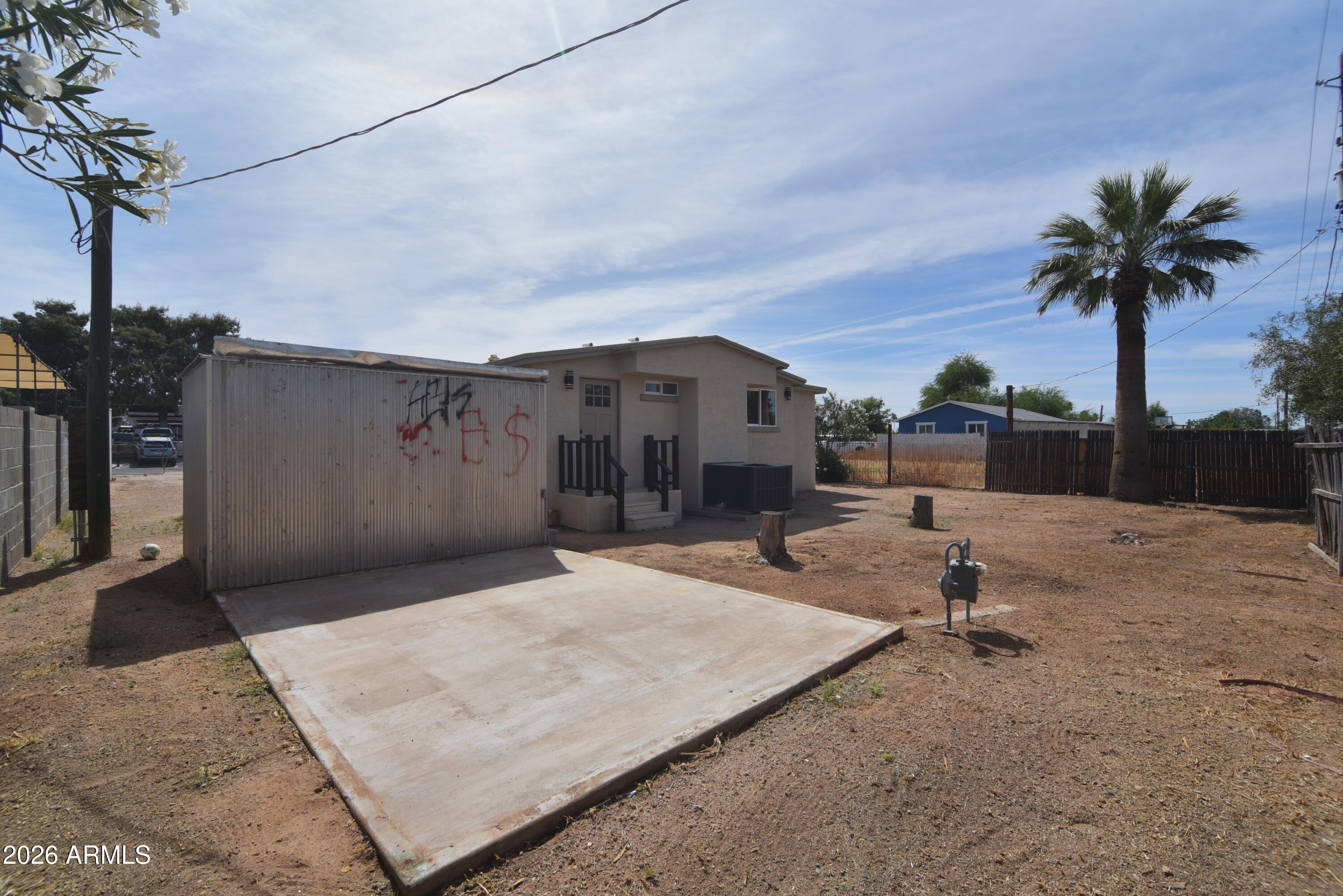 508 South 98th Street Mesa, AZ 85208 - Photo 26 of 34 a backyard of a house with table and chairs