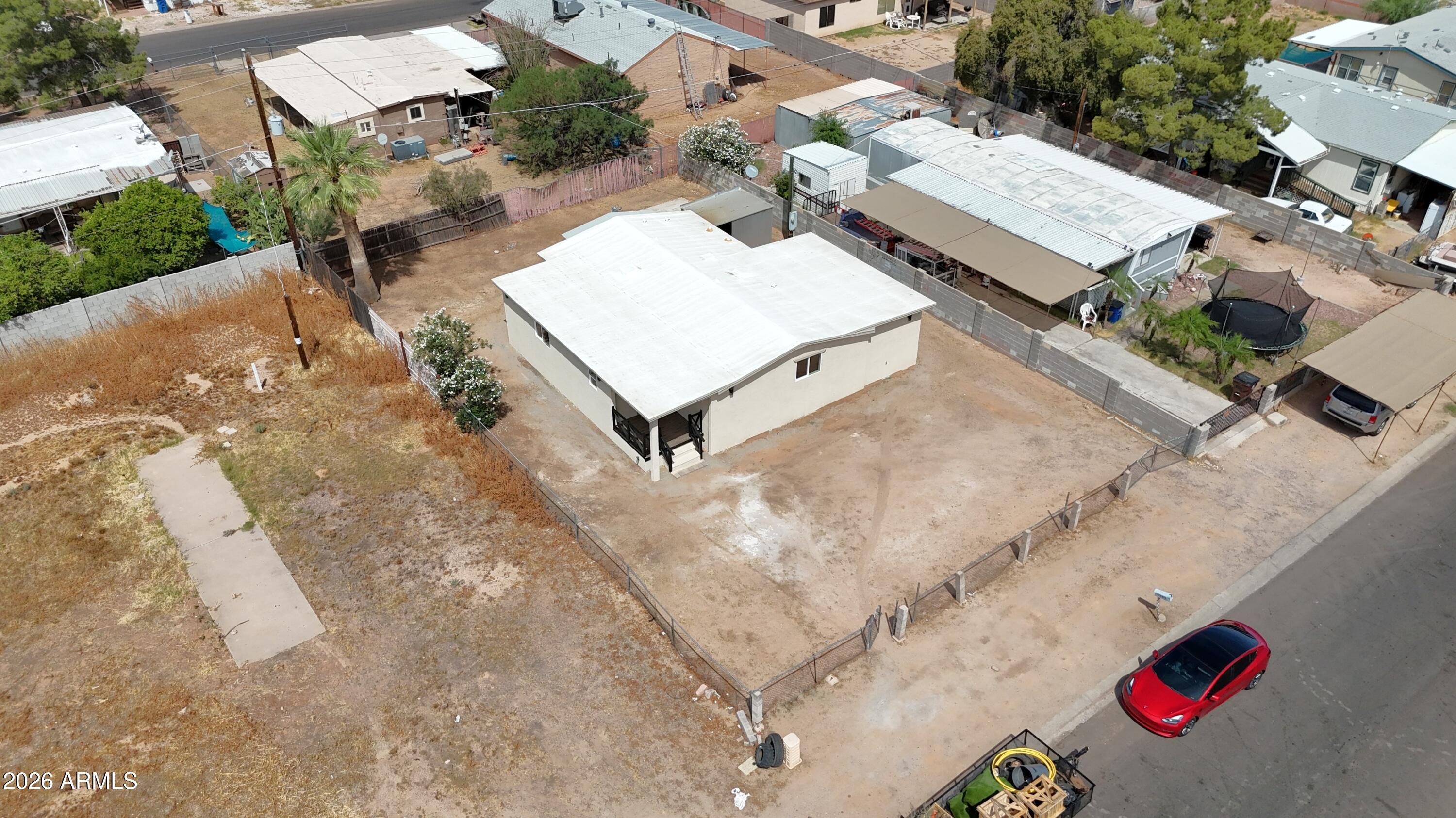 508 South 98th Street Mesa, AZ 85208 - Photo 30 of 34 an aerial view of a house with a backyard and trees