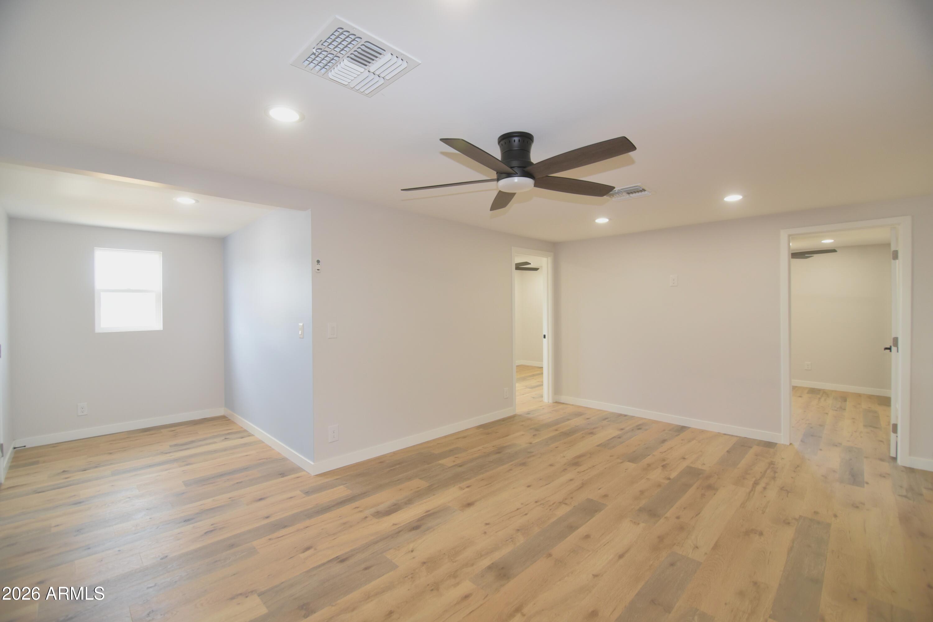 508 South 98th Street Mesa, AZ 85208 - Photo 3 of 34 a view of a big room with wooden floor and windows