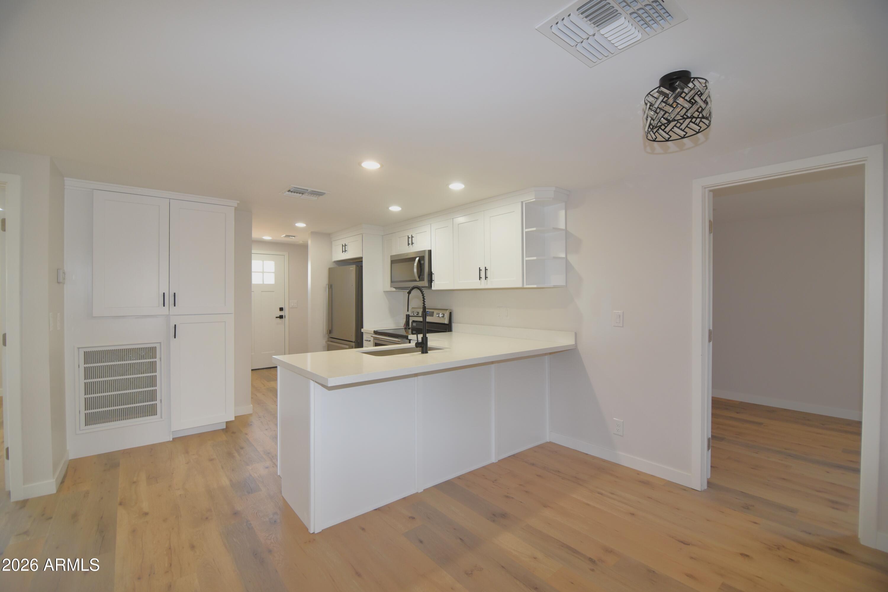 508 South 98th Street Mesa, AZ 85208 - Photo 8 of 34 a view of kitchen with wooden floor