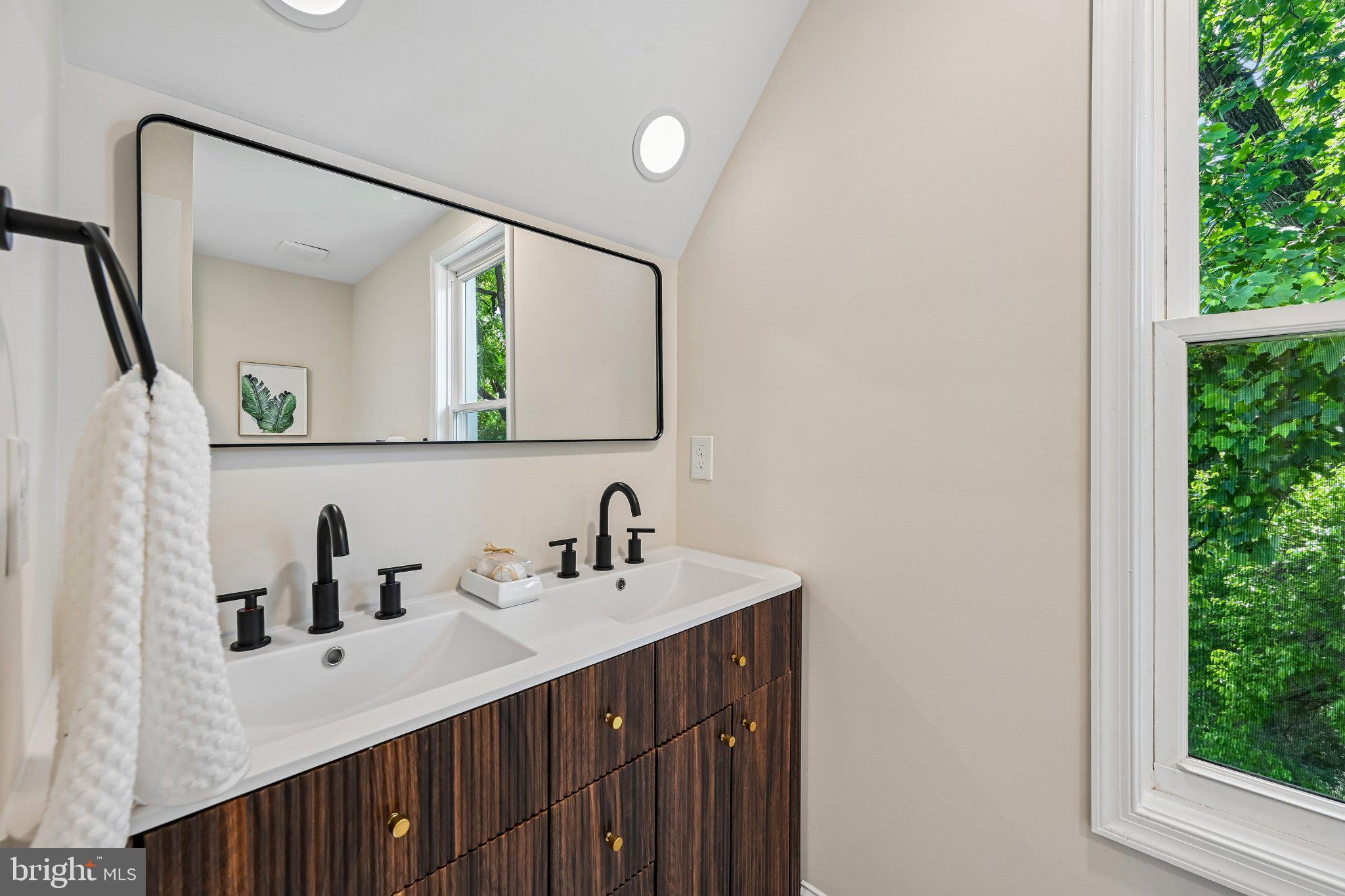 5714 Rusk Avenue Baltimore, MD 21215 - Photo 30 of 51 Sleek modern bathroom with natural light.