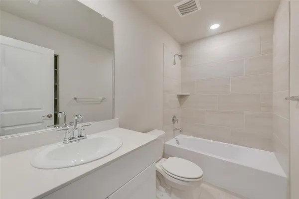 a bathroom with a sink a toilet and a bathtub