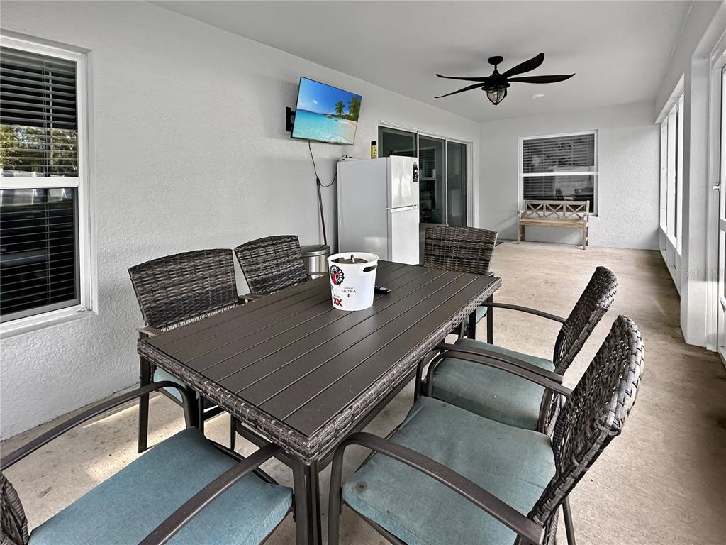 13023 Downy Woodpecker Road Weeki Wachee, FL 34614 - Photo 33 of 43 a view of a dining room with furniture