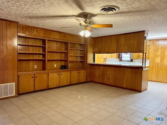 a view of a kitchen with furniture and window