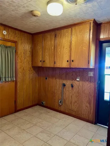 a view of a garage with wooden wall