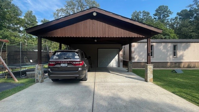 29719 Midland Street Magnolia, TX 77354 - Photo 2 of 21 a car parked in front of a house with wooden fence
