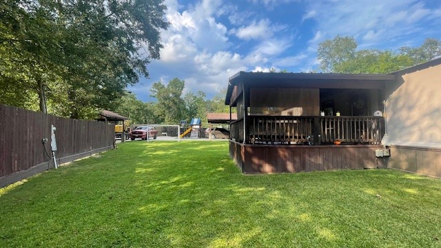 29719 Midland Street Magnolia, TX 77354 - Photo 21 of 21 a view of a backyard with a tub and a tree