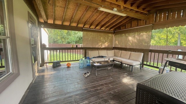 29719 Midland Street Magnolia, TX 77354 - Photo 7 of 21 a view of a porch with furniture and wooden floor