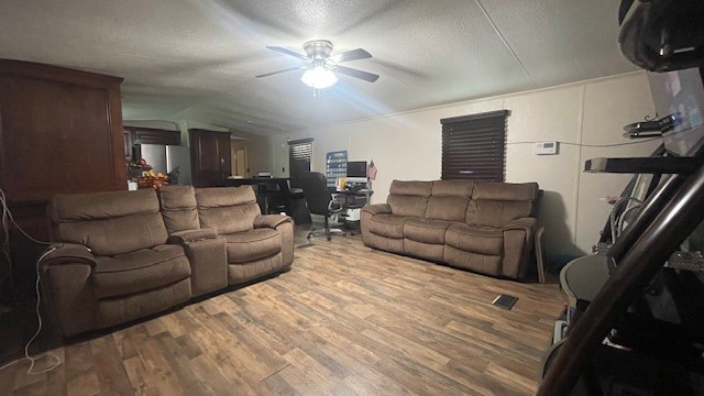 29719 Midland Street Magnolia, TX 77354 - Photo 8 of 21 a living room with furniture a ceiling fan a lamp and a window