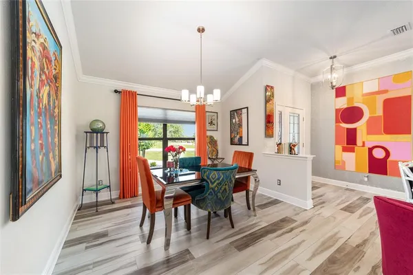 a kitchen with stainless steel appliances kitchen island granite countertop furniture and a refrigerator