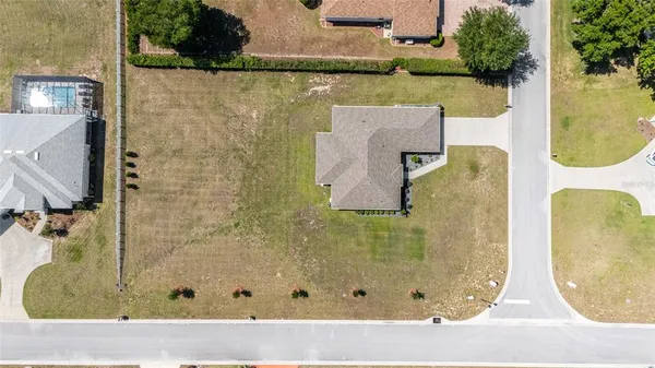 a view of a house with backyard sitting area and garden