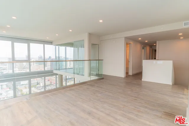 a view of an empty room with a large window