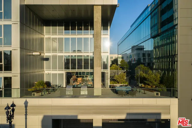 a view of swimming pool with outdoor seating and plants