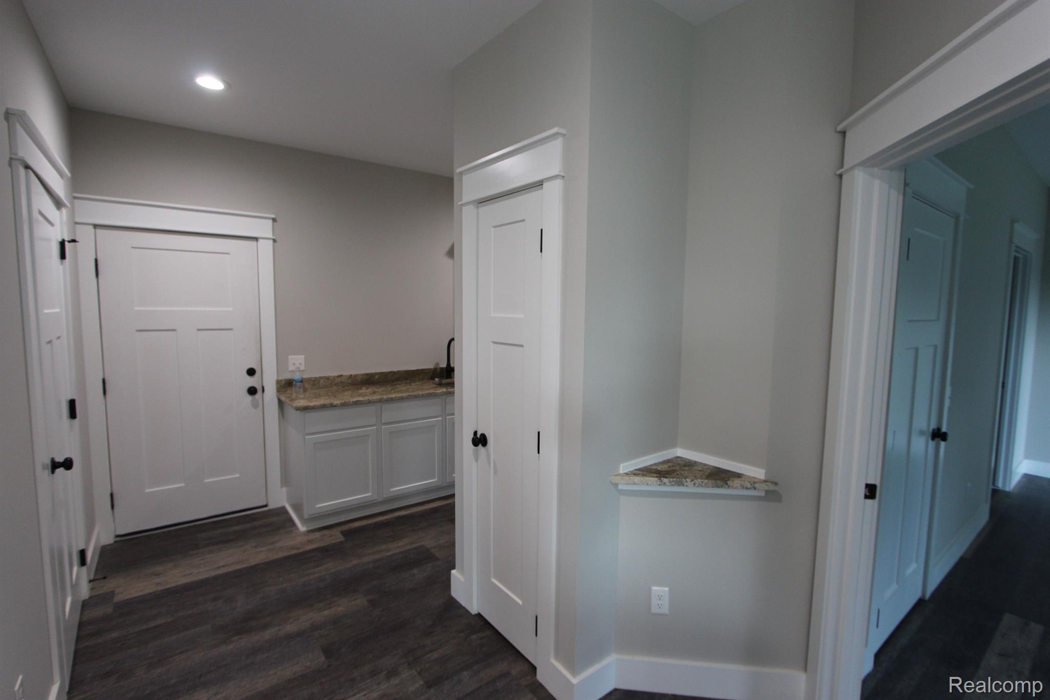 2975 East Coon Lake Road Howell, MI 48843 - Photo 37 of 175 ENTRANCE INTO HOUSE FROM GARAGE LAUNDRY ROOM