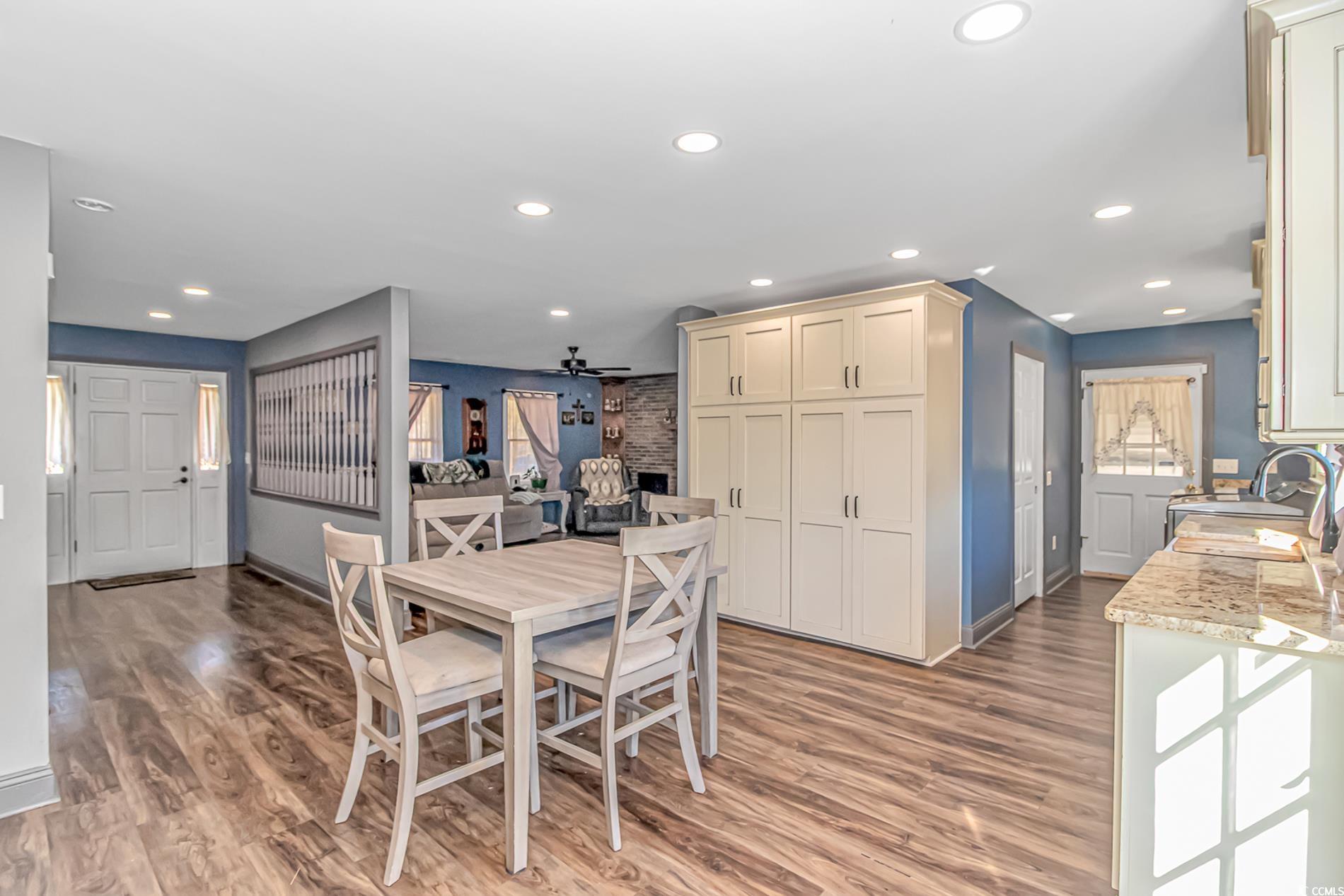 4106 Edwards Road Aynor, SC 29511 - Photo 14 of 39 Dining area featuring a fireplace, ceiling fan, si