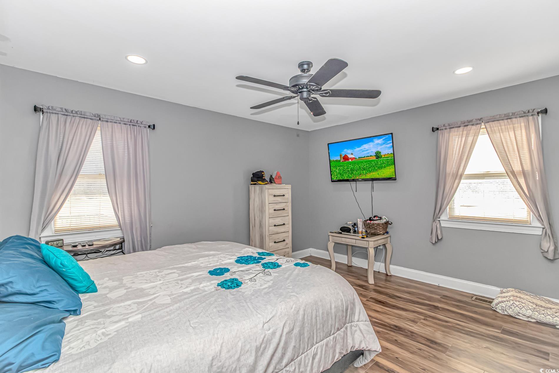 4106 Edwards Road Aynor, SC 29511 - Photo 16 of 39 Bedroom featuring multiple windows, hardwood / woo